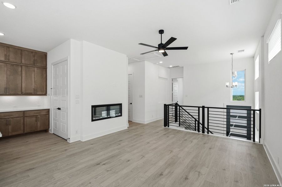Spacious, unfurnished interior of a new home in Centero at Stone Oak, San Antonio (Image 33).