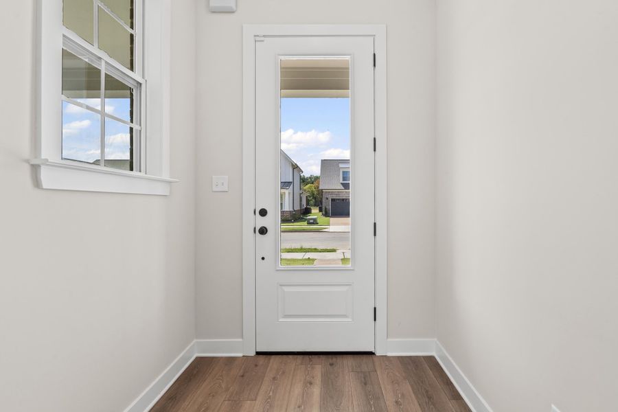 Entryway featuring wood finished floors and plenty of natural light Entryway featuring wood finished floors and plenty of natural light