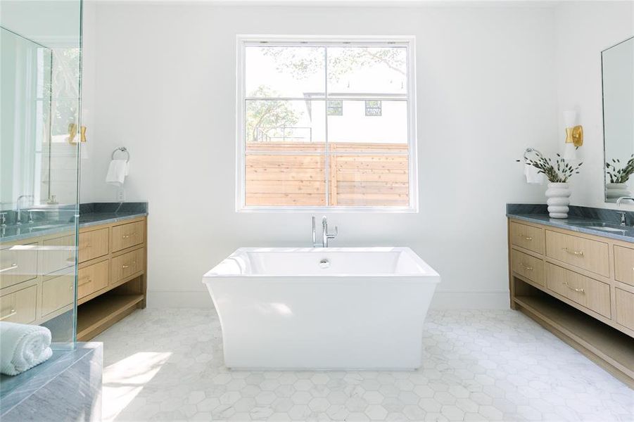 Bathroom featuring vanity and a bathing tub