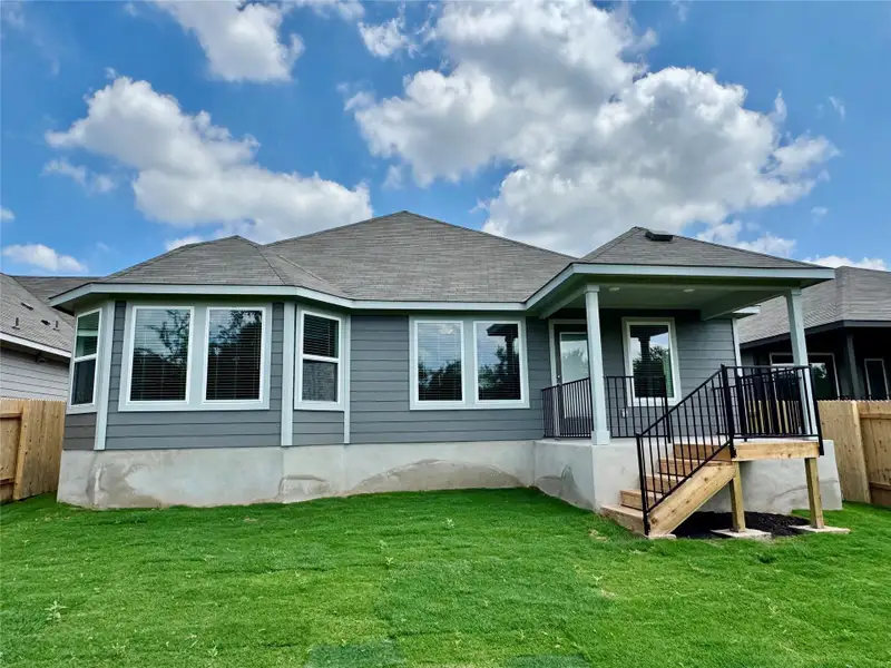 Rear view of house featuring roof with shingles Rear view of house featuring roof with shingles