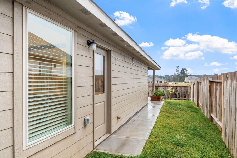 Exterior details and patio area of a home in Magnolia Ridge: Cottage Collection, Magnolia (Image 20).