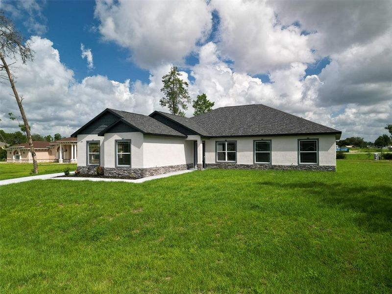 Front exterior of a new home in , Ocala, FL, highlighting curb appeal (Image 29). Front exterior of a new home in , Ocala, FL, highlighting curb appeal (Image 29).