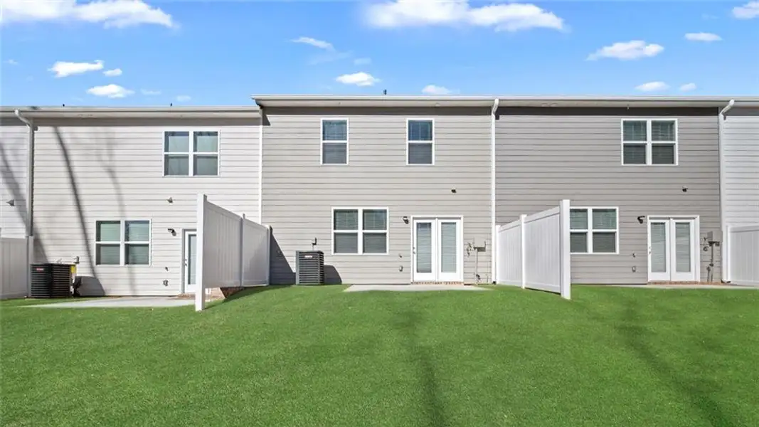 Exterior details and patio area of a home in Inverness at Sugarloaf, Lawrenceville (Image 3).