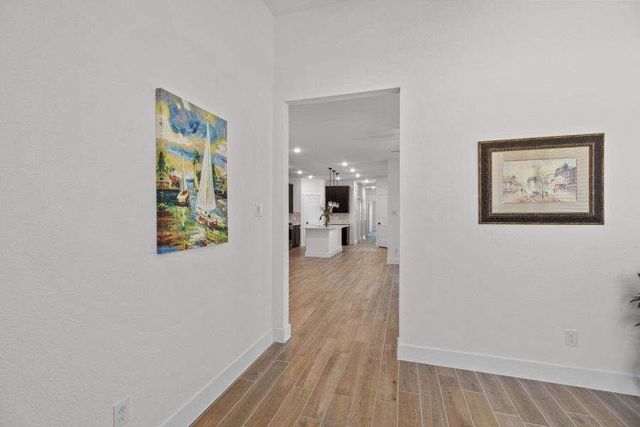 Head from the dedicated study or home office to the open concept floorplan living areas.