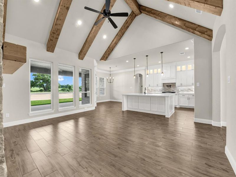 Unfurnished living room with a sink, a ceiling fan, recessed lighting, baseboards, and beam ceiling Unfurnished living room with a sink, a ceiling fan, recessed lighting, baseboards, and beam ceiling