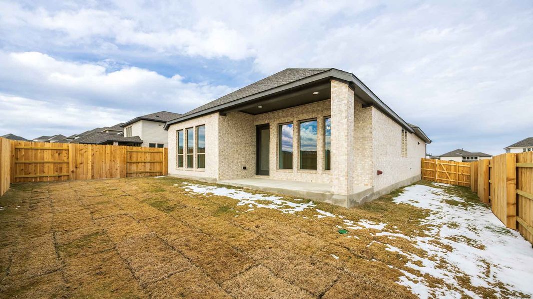 Exterior details and patio area of a home in Lariat 50', Liberty Hill (Image 2).