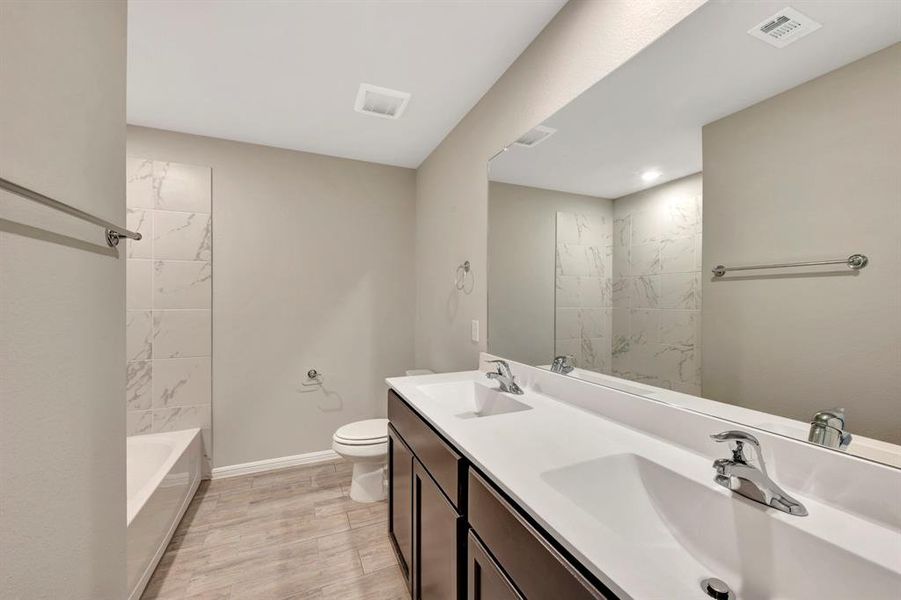 Furnished interior view inside a new home in Woodstone, Providence Village (Image 10). Furnished interior view inside a new home in Woodstone, Providence Village (Image 10).