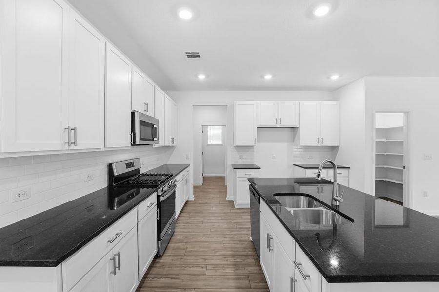 Furnished interior view inside a new home in Longview 40s, Del Valle (Image 5).