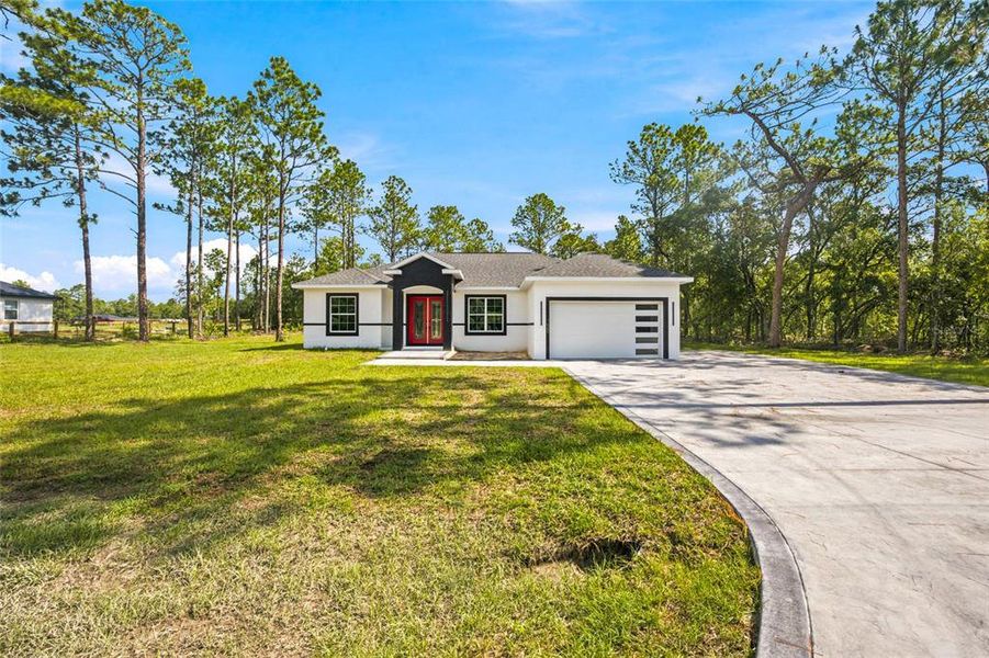 Front exterior of a new home in , Dunnellon, FL, highlighting curb appeal (Image 19). Front exterior of a new home in , Dunnellon, FL, highlighting curb appeal (Image 19).