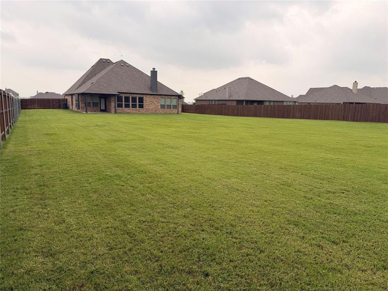 Exterior details and patio area of a home in Coyote Crossing, Godley (Image 26).