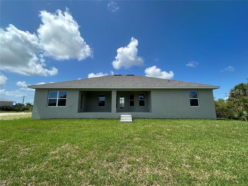 Front exterior of a new home in Deep Creek, Punta Gorda, FL, highlighting curb appeal (Image 14).