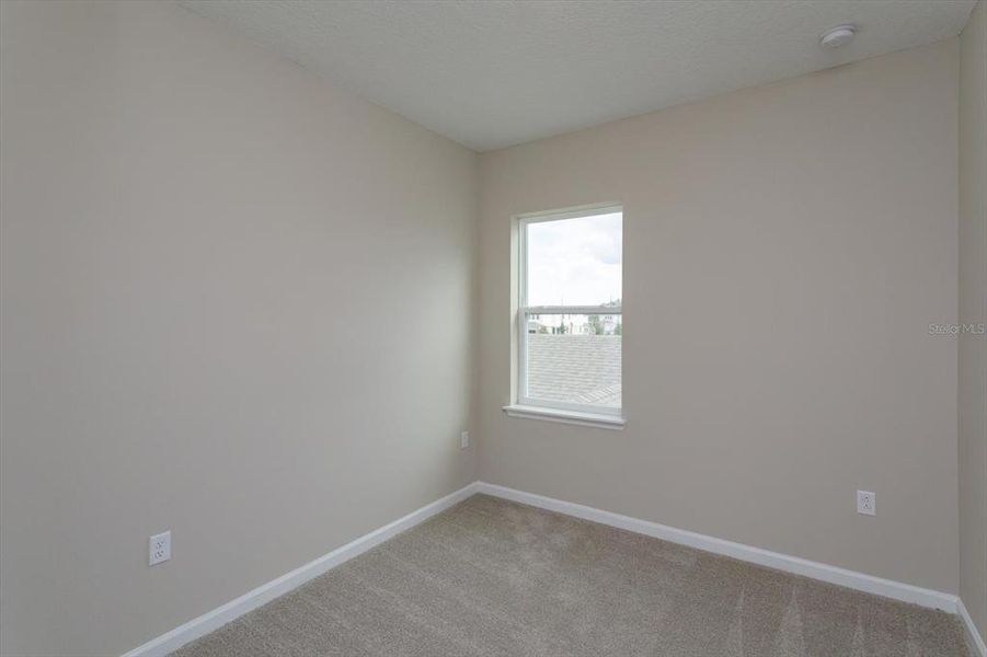 Spacious, unfurnished interior of a new home in Serenade at Ovation, Winter Garden (Image 22).