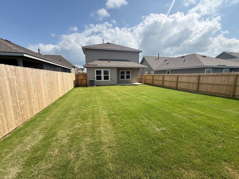 Exterior details and patio area of a home in Midtown Reserve, College Station (Image 15).