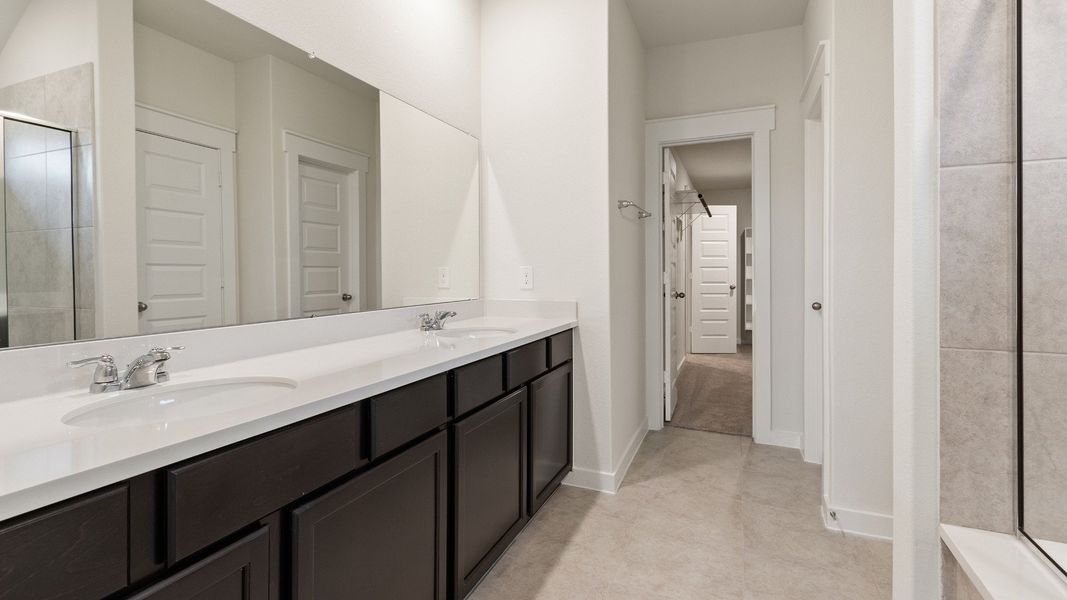 Representative furnished interior of a home built from the Driskill by Brightland Homes in Sunterra, Katy (Image 10).