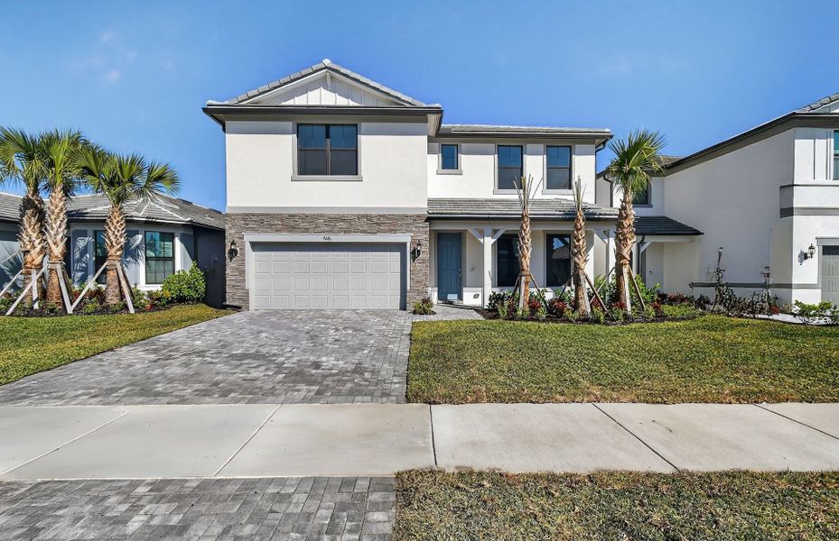 Front exterior of a new home in Hendrix Reserve, Lake Worth, FL, highlighting curb appeal (Image 20).