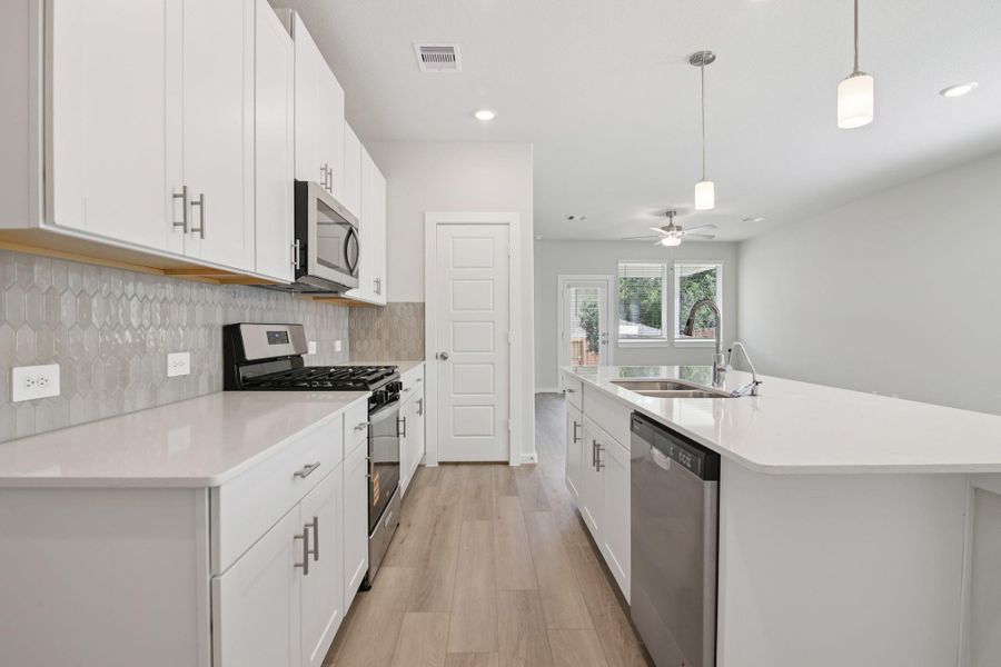 Furnished interior view inside a new home in Pine Lake Cove - Traditional Series, Montgomery (Image 9).