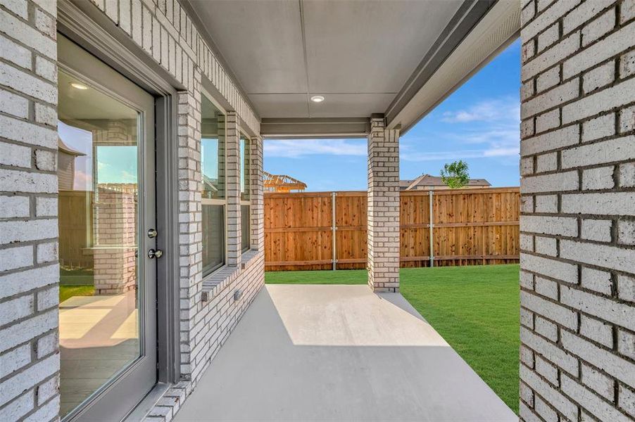 Exterior details and patio area of a home in Lily Creek at Sutton Fields, Aubrey (Image 23).