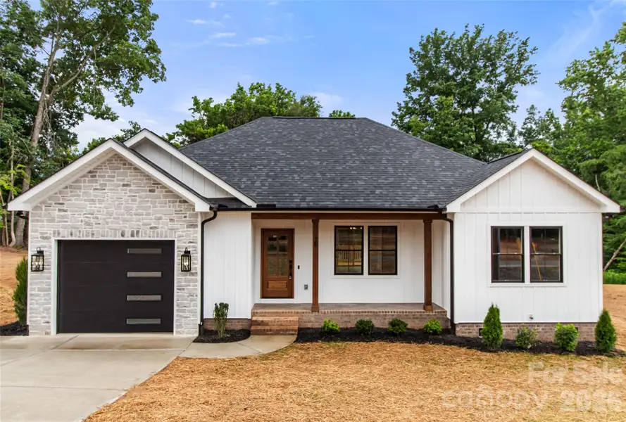 Front exterior of a new home in , Concord, NC, highlighting curb appeal (Image 2). Front exterior of a new home in , Concord, NC, highlighting curb appeal (Image 2).