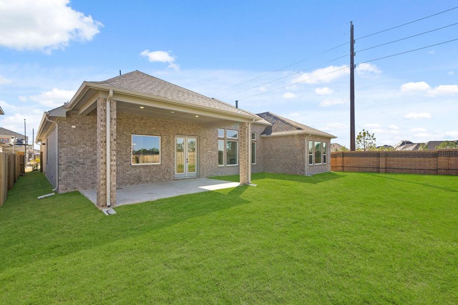 The empty backyard is a wide, open space with a well-kept lawn, waiting to be shaped into a personalized outdoor retreat. The empty backyard is a wide, open space with a well-kept lawn, waiting to be shaped into a personalized outdoor retreat.