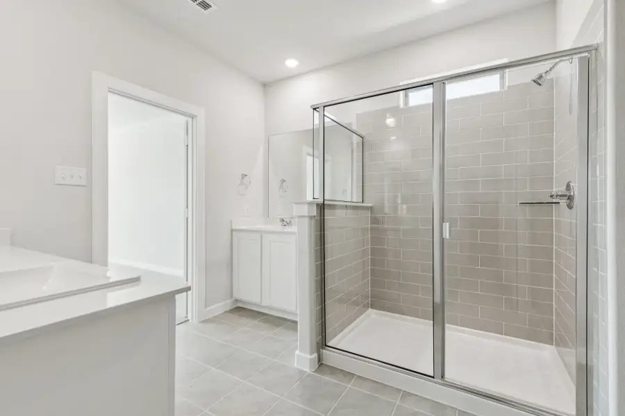 Primary Bathroom in the Winters home plan by Trophy Signature Homes – REPRESENTATIVE PHOTO