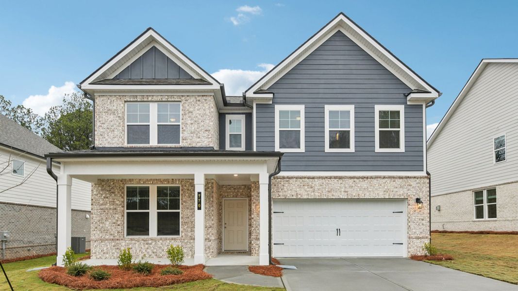 Representative exterior photo of a completed home built from the Wynwood by DRB Homes in Hamilton Lakes, Loganville, GA (Image 27).