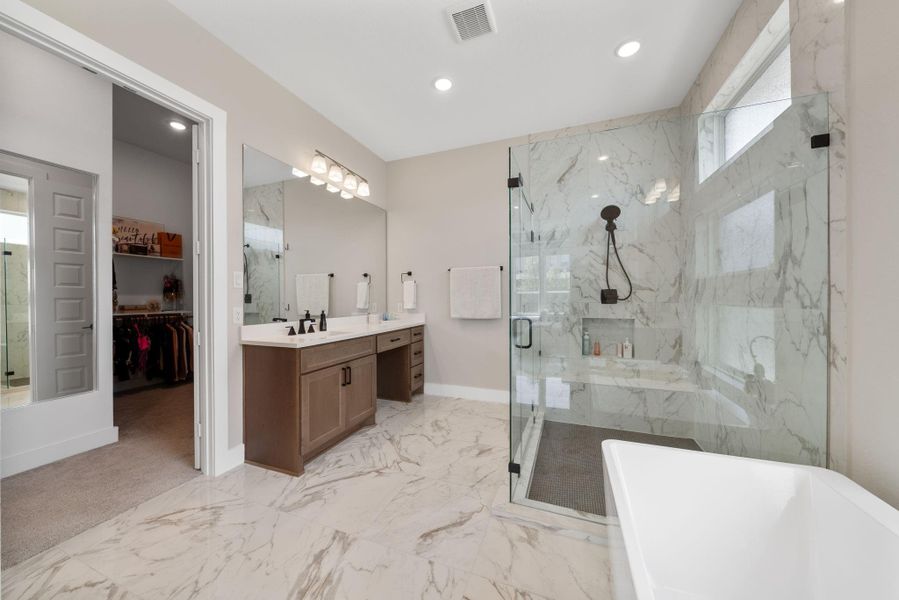 With plenty of storage in the cabinets and a well-designed layout, this bathroom provides both style and convenience, creating a spa-like retreat within the home. With plenty of storage in the cabinets and a well-designed layout, this bathroom provides both style and convenience, creating a spa-like retreat within the home.
