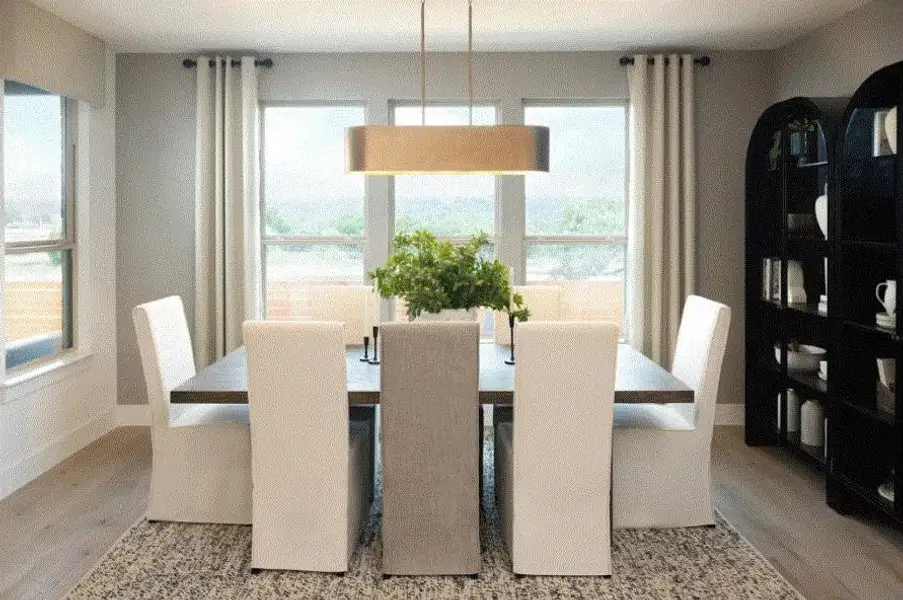 Photo of Pulte model home with same floor plan, not of actual home listed.