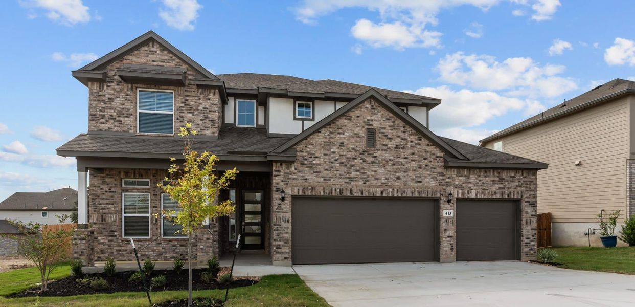 Front exterior of a new home in Buffalo Crossing – New Phase Now Preselling, Cibolo, TX, highlighting curb appeal (Image 2).