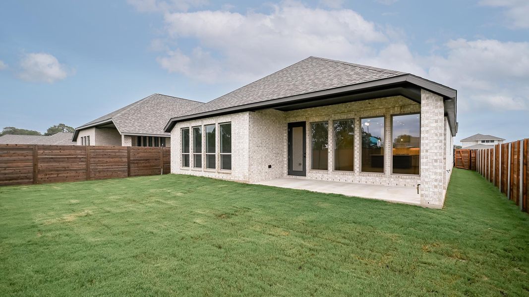 Exterior details and patio area of a home in Juniper Springs, Lockhart (Image 21).