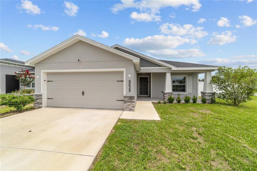 Front exterior of a new home in , Ocala, FL, highlighting curb appeal (Image 2). Front exterior of a new home in , Ocala, FL, highlighting curb appeal (Image 2).