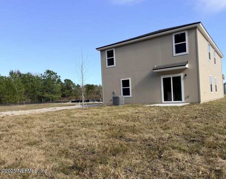 Exterior details and patio area of a home in The Arbors, Jacksonville (Image 4).
