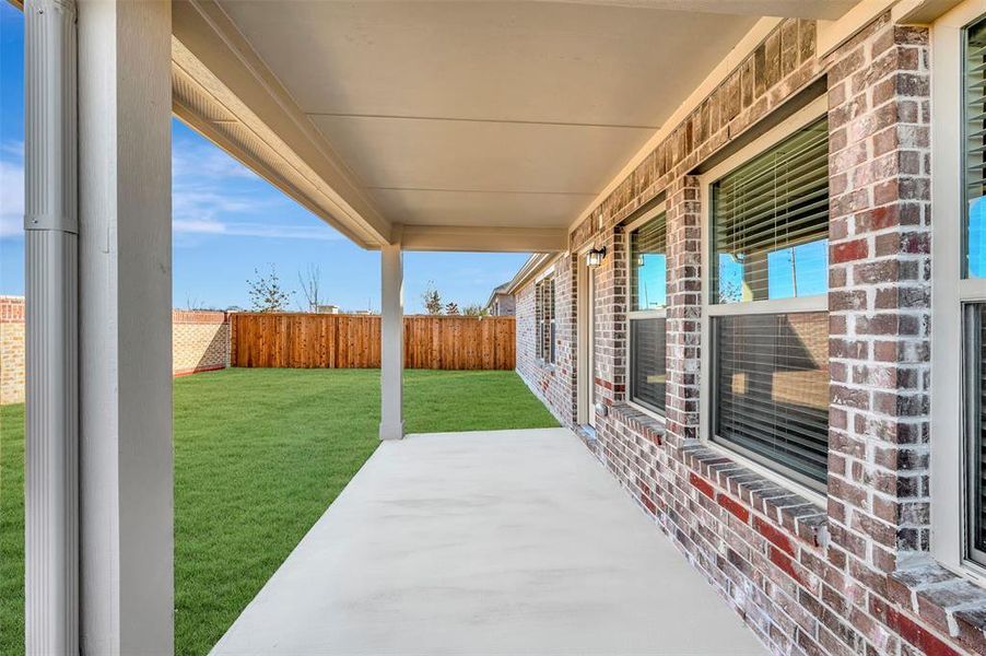 Exterior details and patio area of a home in The Preserve, Justin (Image 22).