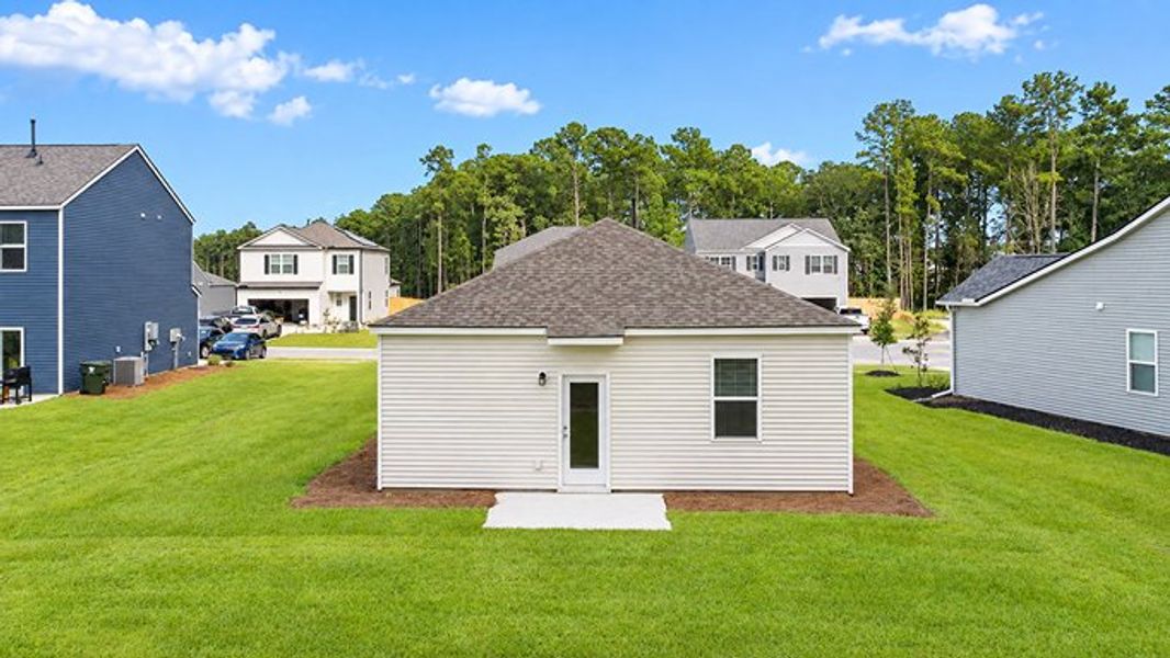 Exterior details and patio area of a home in Pine Hills at Cane Bay, Summerville (Image 3).