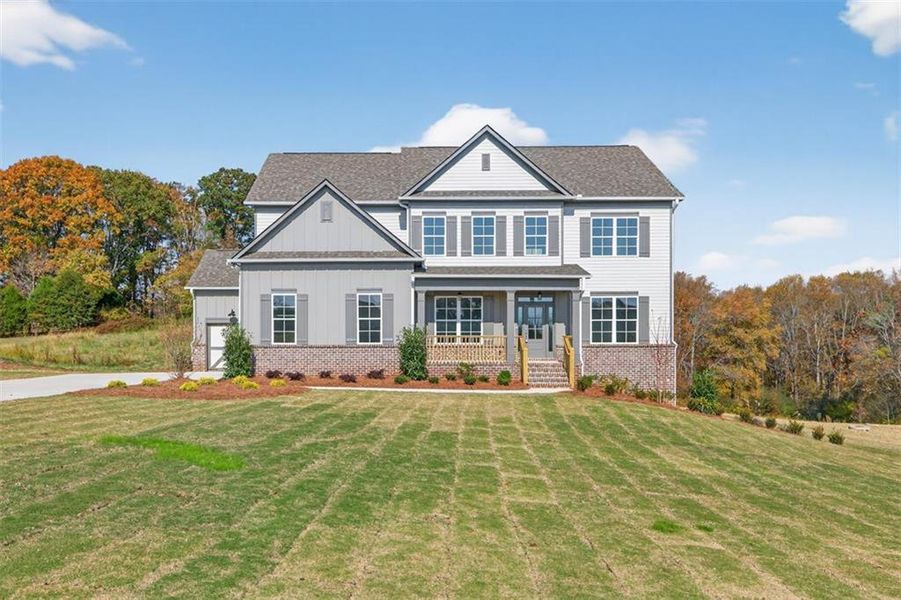 Front exterior of a new home in , Gainesville, GA, highlighting curb appeal (Image 27). Front exterior of a new home in , Gainesville, GA, highlighting curb appeal (Image 27).
