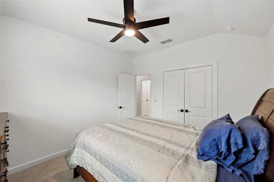 This third bedroom offers added comfort and convenience with a double-door closet and a ceiling fan with integrated lighting. This third bedroom offers added comfort and convenience with a double-door closet and a ceiling fan with integrated lighting.