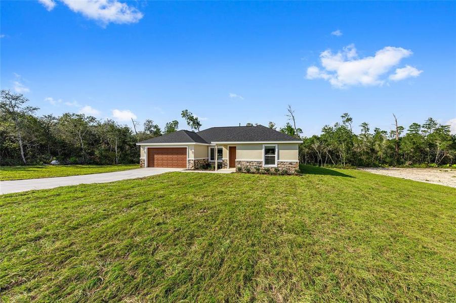 Front exterior of a new home in , Ocala, FL, highlighting curb appeal (Image 30).