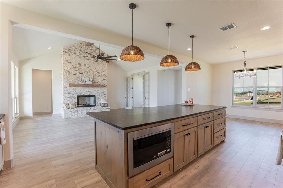 WOW - What an island. Storage galore accented by the modern pendants and gorgeous countertops! WOW - What an island. Storage galore accented by the modern pendants and gorgeous countertops!