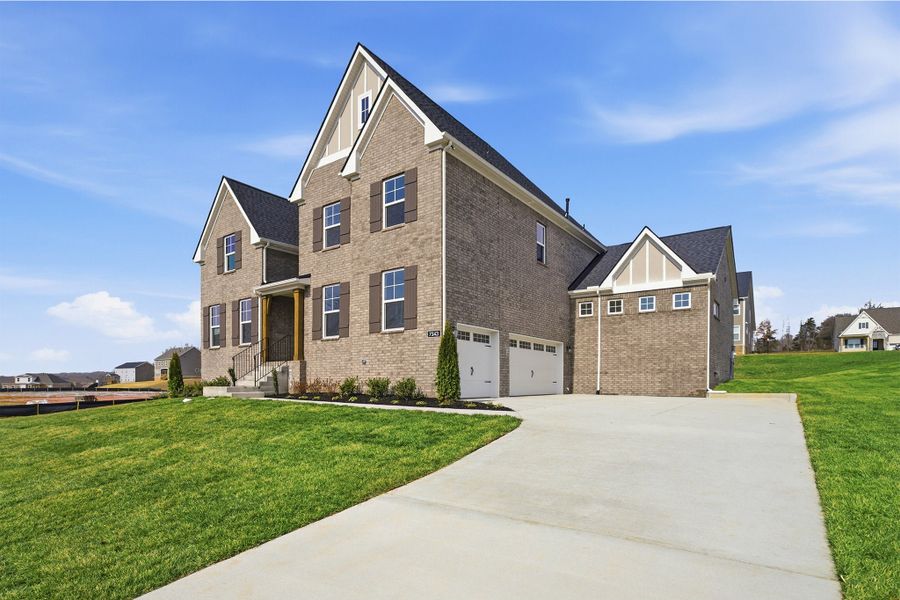 Front exterior of a new home in Aden Woods, Fairview, TN, highlighting curb appeal (Image 2). Front exterior of a new home in Aden Woods, Fairview, TN, highlighting curb appeal (Image 2).
