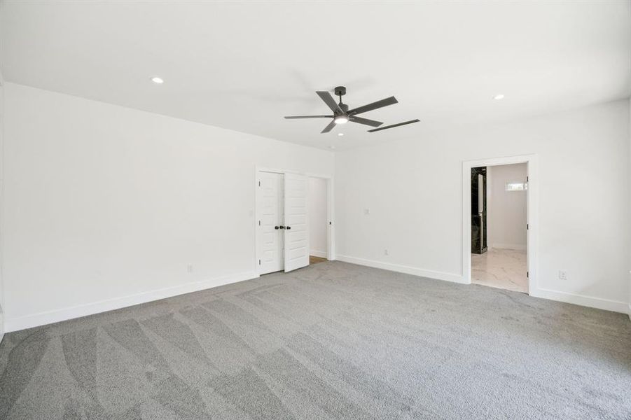 Unfurnished bedroom with carpet, recessed lighting, and a ceiling fan