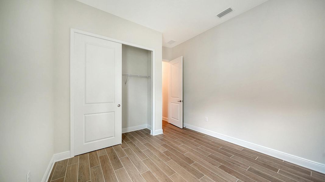 Spacious, unfurnished interior of a new home in Canoe Creek Real Estate and Homes for Sale in Parrish, FL - Neal Communities, Parrish (Image 48).