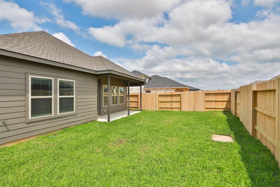 Front exterior of a new home in Cypress Green, Hockley, TX, highlighting curb appeal (Image 15). Front exterior of a new home in Cypress Green, Hockley, TX, highlighting curb appeal (Image 15).