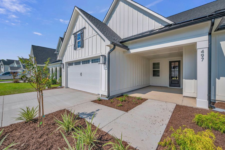 Representative exterior photo of a completed home built from the The Bradley by RobuckHomes in Windwater, Hampstead, NC (Image 29).