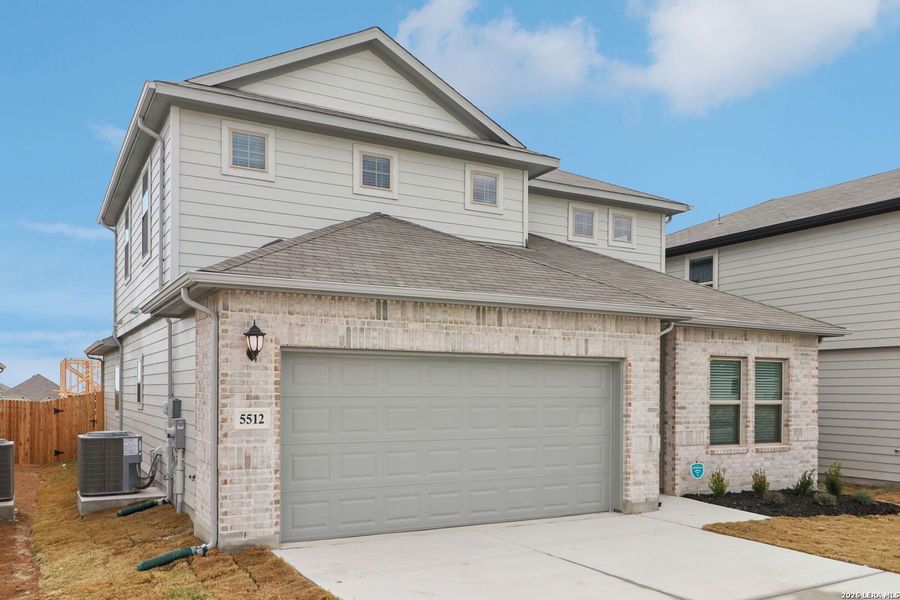 Front exterior of a new home in Legendary Trails - Premier Series, Cibolo, TX, highlighting curb appeal (Image 25).