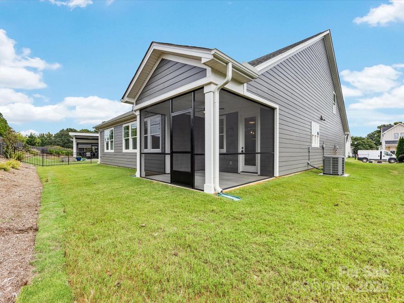 Front exterior of a new home in Phillips Village, Matthews, NC, highlighting curb appeal (Image 1).