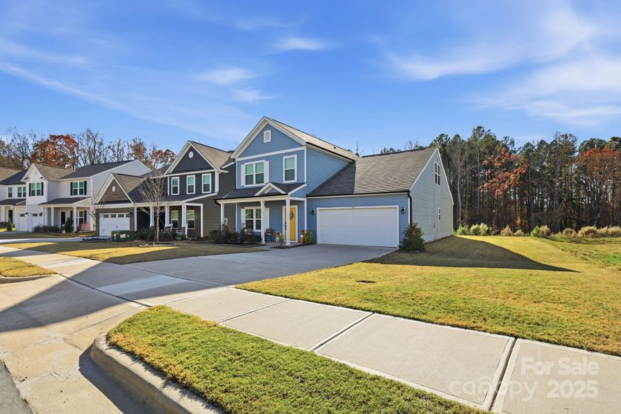 Front exterior of a new home in , Statesville, NC, highlighting curb appeal (Image 21).