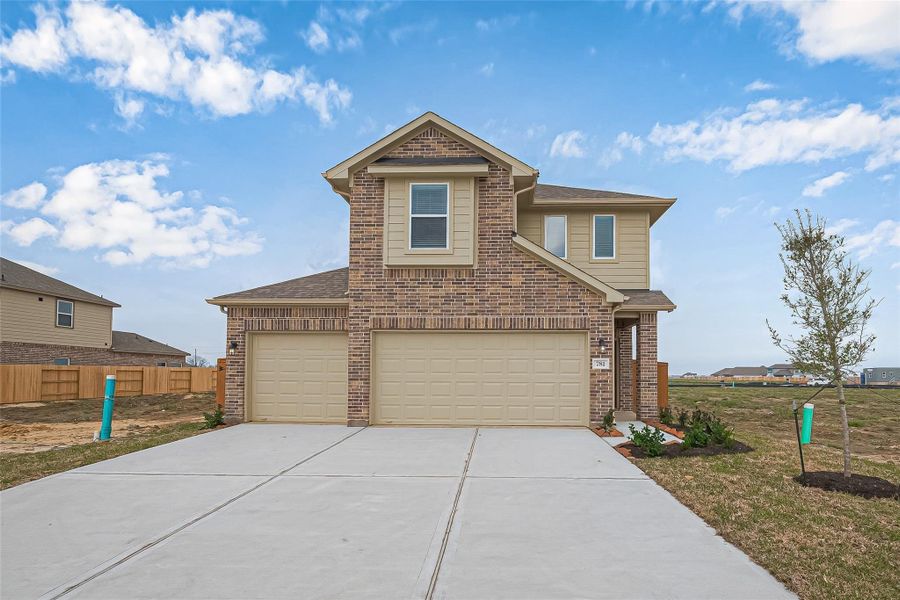 Front exterior of a new home in River Ranch, Dayton, TX, highlighting curb appeal (Image 18). Front exterior of a new home in River Ranch, Dayton, TX, highlighting curb appeal (Image 18).