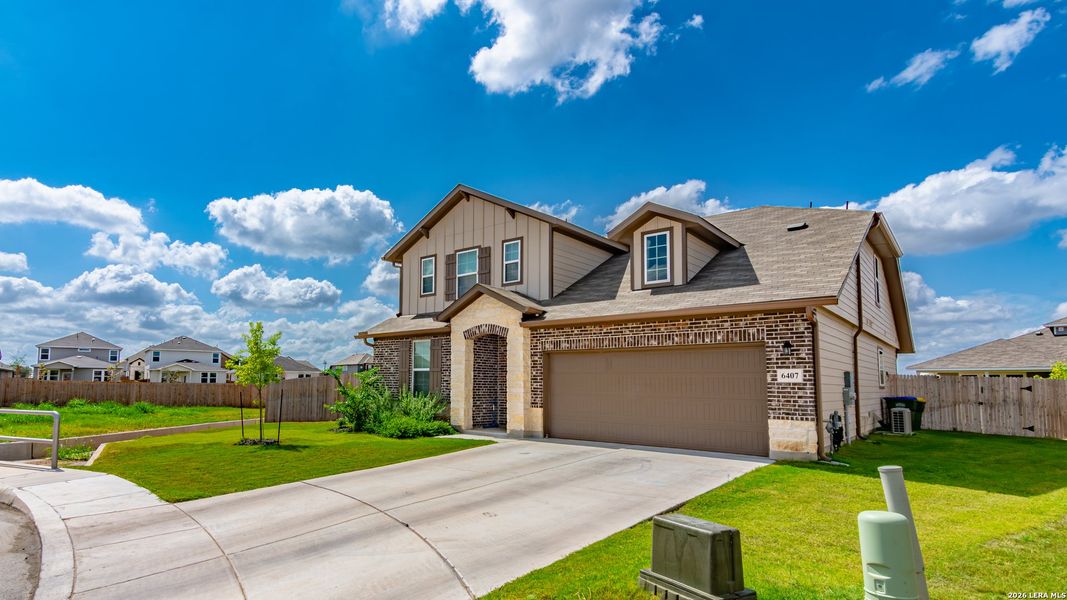 Front exterior of a new home in Morgan Meadows, San Antonio, TX, highlighting curb appeal (Image 2). Front exterior of a new home in Morgan Meadows, San Antonio, TX, highlighting curb appeal (Image 2).