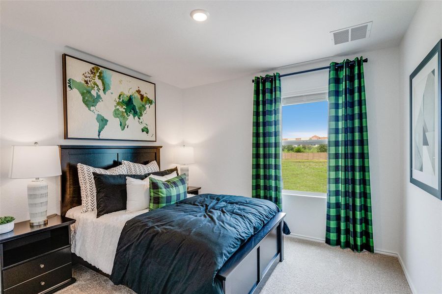 Carpeted bedroom with baseboards Carpeted bedroom with baseboards