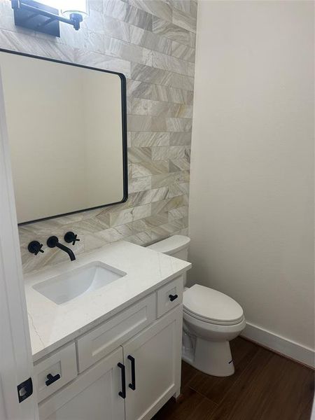 Powder Bath off entrance hallway.