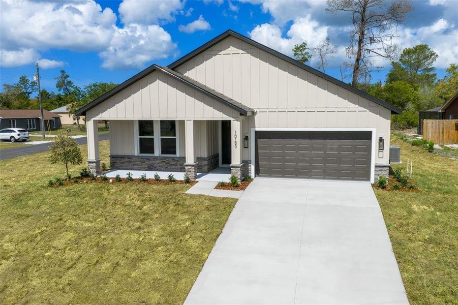 Front exterior of a new home in , Spring Hill, FL, highlighting curb appeal (Image 27). Front exterior of a new home in , Spring Hill, FL, highlighting curb appeal (Image 27).
